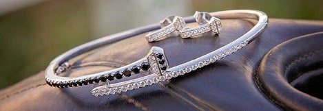 Silver Horseshoe Nail Bracelet - black colored stones