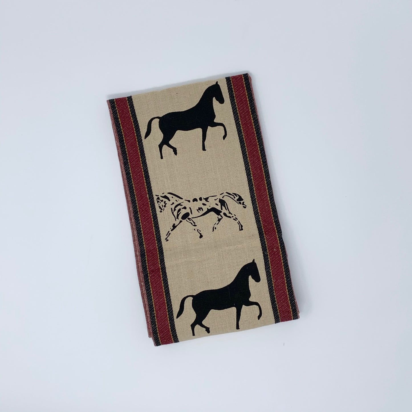 Waffle Weave Horse Kitchen Towel Tan Background Red and Black Stripe Black Silhoutte of Horses in Middle