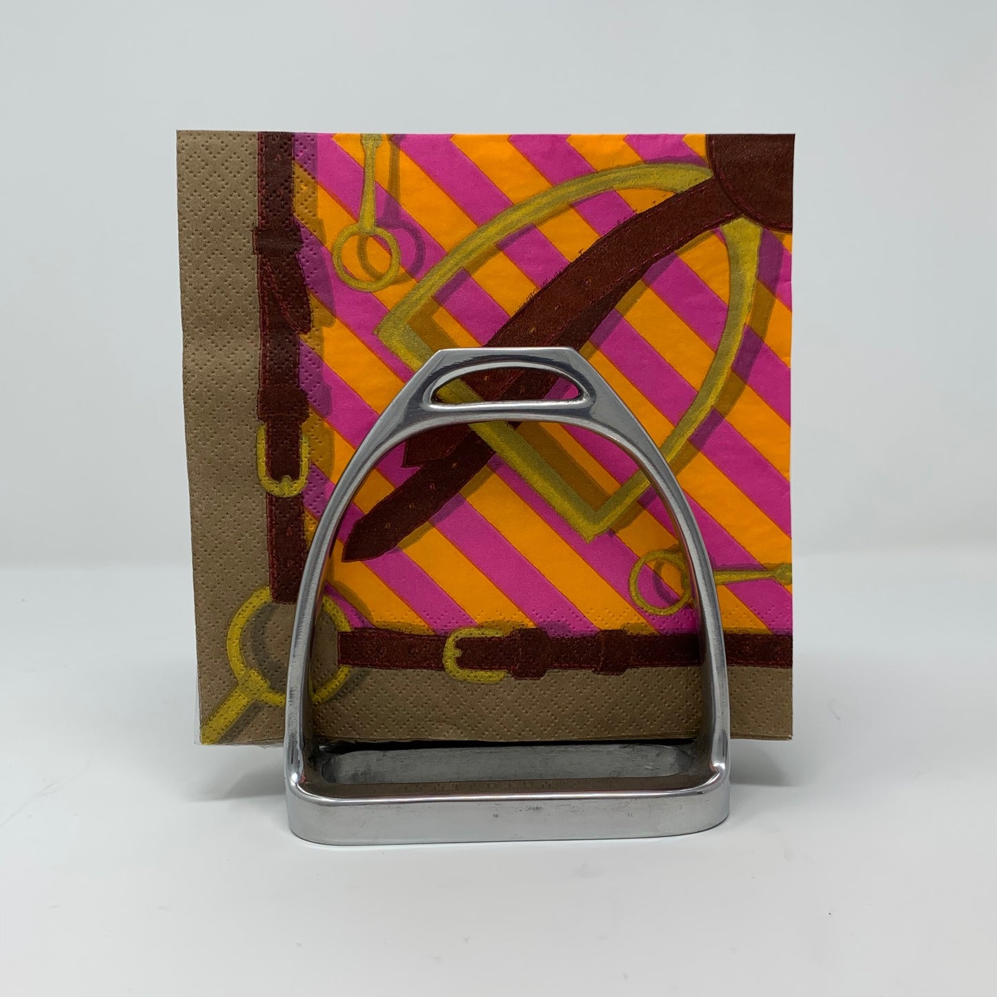 Two Side by Side Stirrups Form Napkin Holder Pictured with Napkins